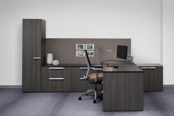 A classic storage workwall with adjoining worksurface makes the most of the compact private office.