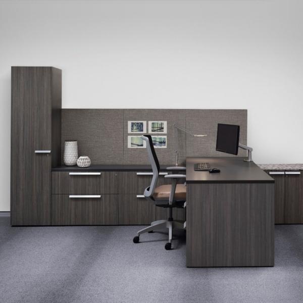 A classic storage workwall with adjoining worksurface makes the most of the compact private office.